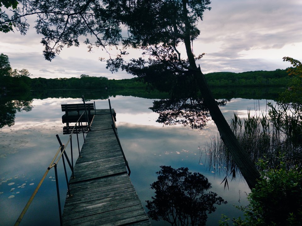 a dock on a calm lake