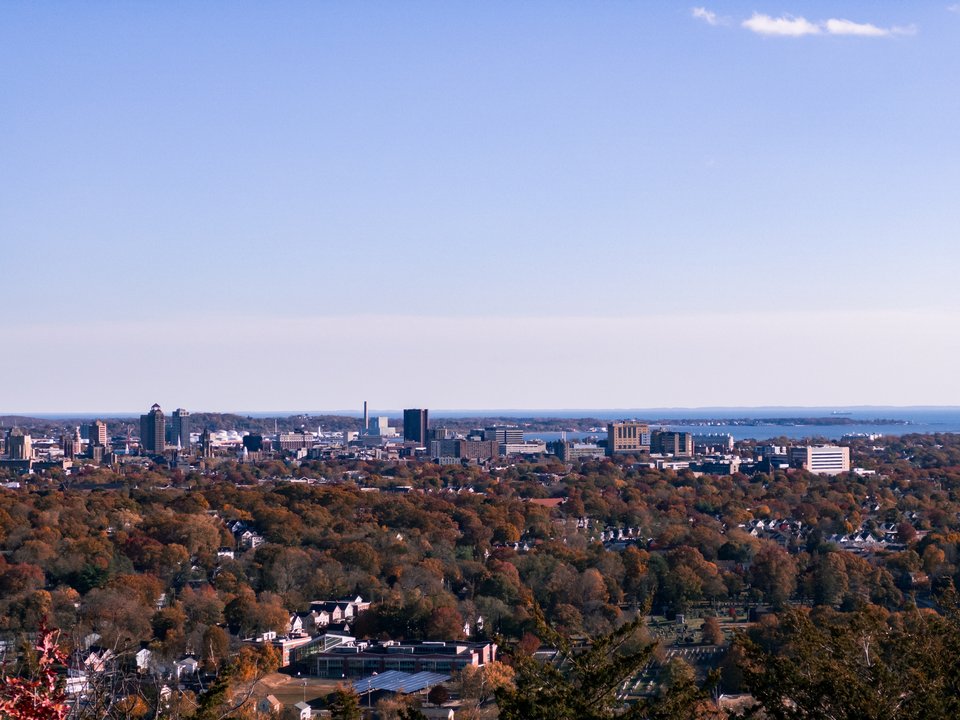 view from the top of west rock, the city of new haven with fall leaf colors