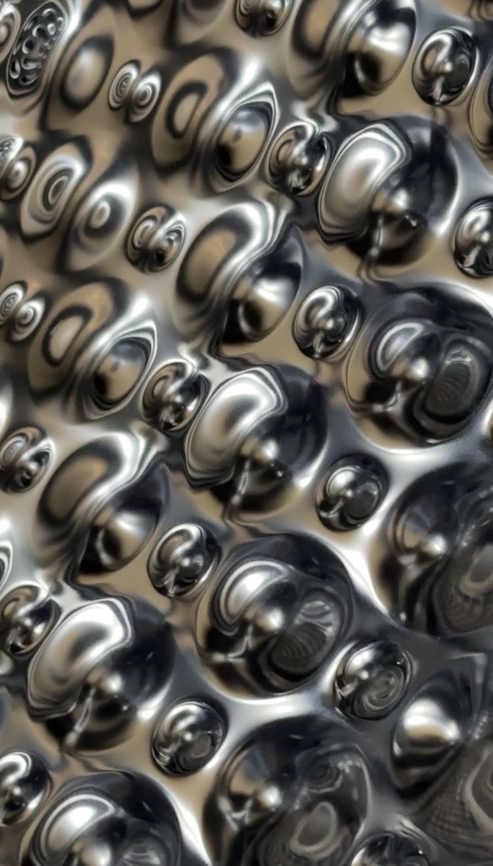abstract reflective metal pattern that looks like a 3D render