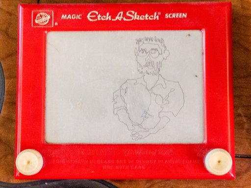 etch-a-sketch showing a messy doodle of a person with beard