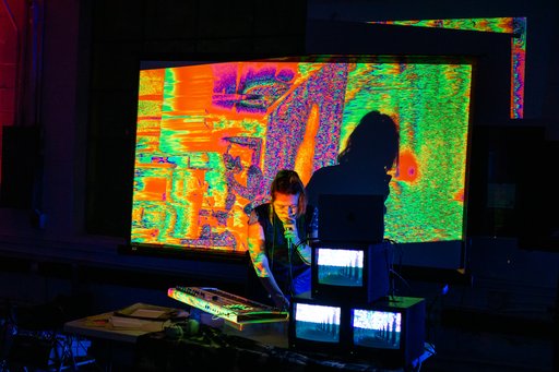 anna oxygen with colorful visuals and three CRT screens stacked on the table