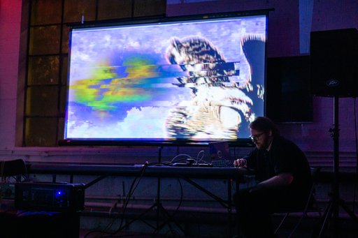 konopka performing with glitchy visuals