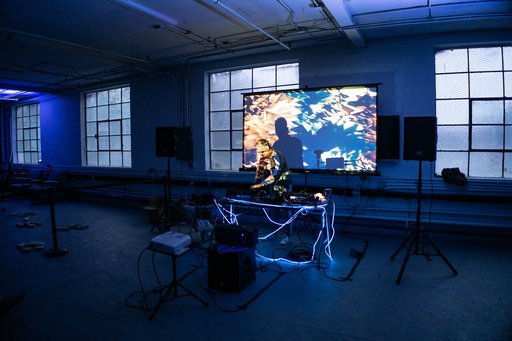 andrei performing at ely center with synth hardware and projections