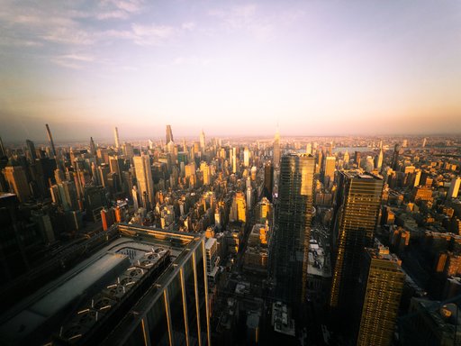 manhattan from a tall building in the golden hour
